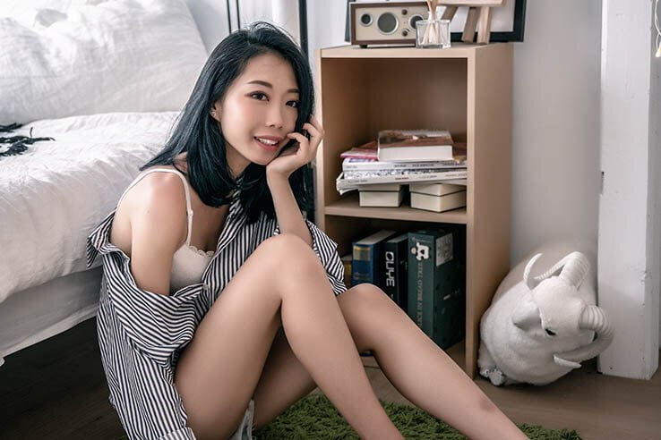 asian girl near bed
